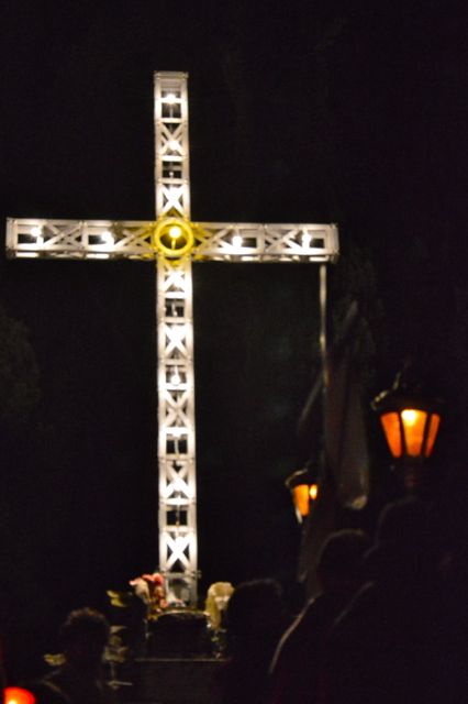 Local cross on top of the mountain lit for the Easter fesitivities